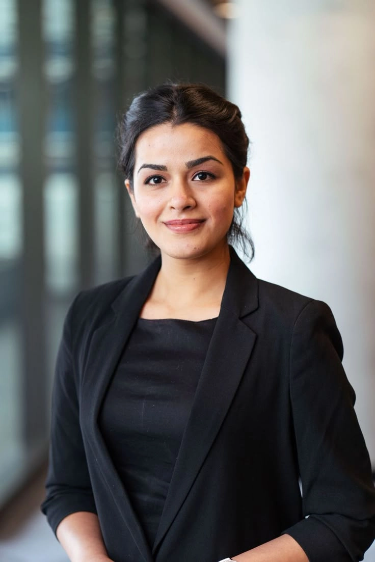 this is an image of a lady wearing a professional outfit who is a freelance digital marketer in Muscat